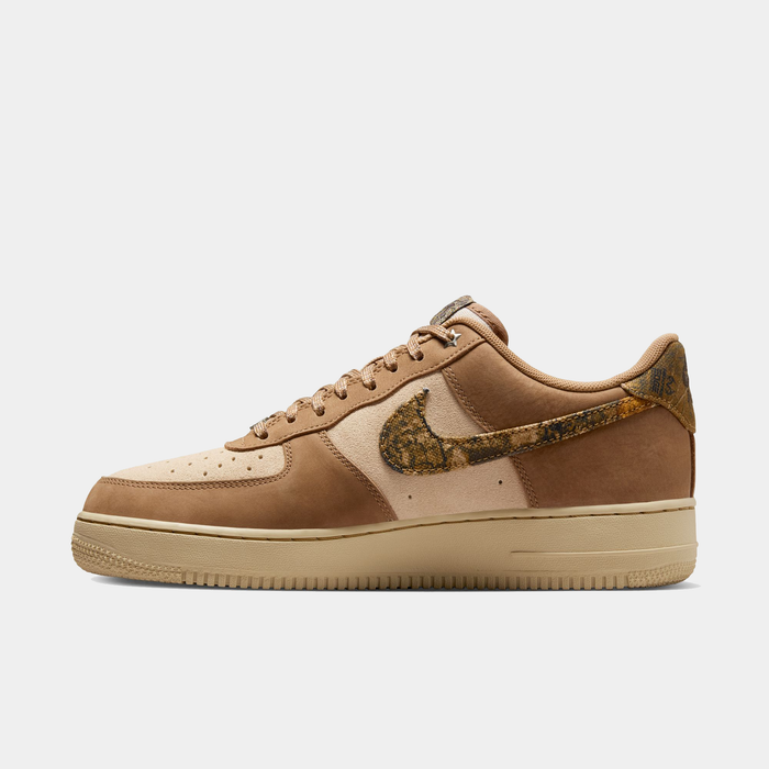 Nike Air Force 1 '07 RealTree sneakers in tan and beige with a camo-patterned Swoosh and suede upper, side view.