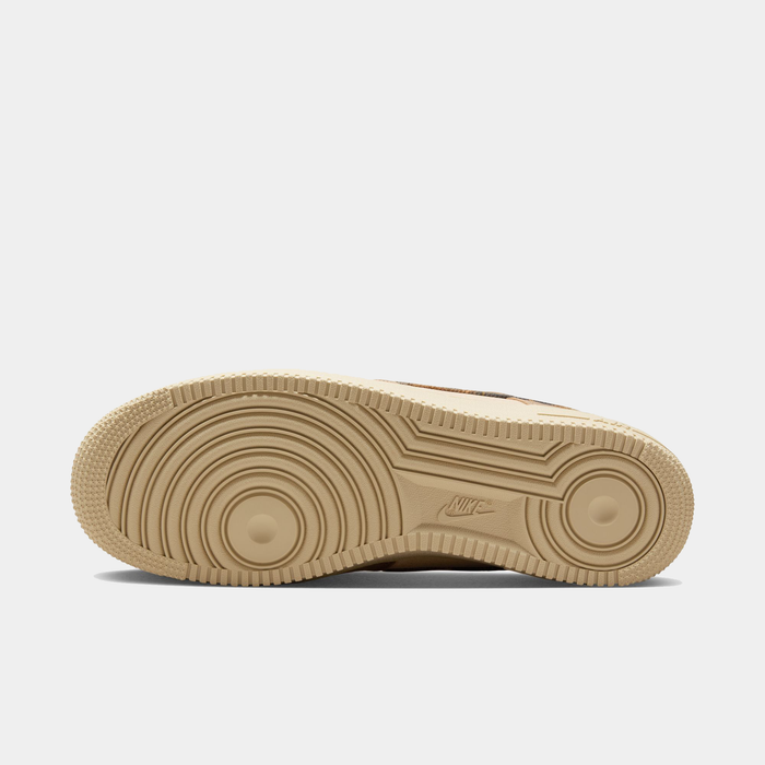 Nike Air Force 1 '07 RealTree shoe outsole in beige with circular tread pattern and embossed Nike logo, bottom view.