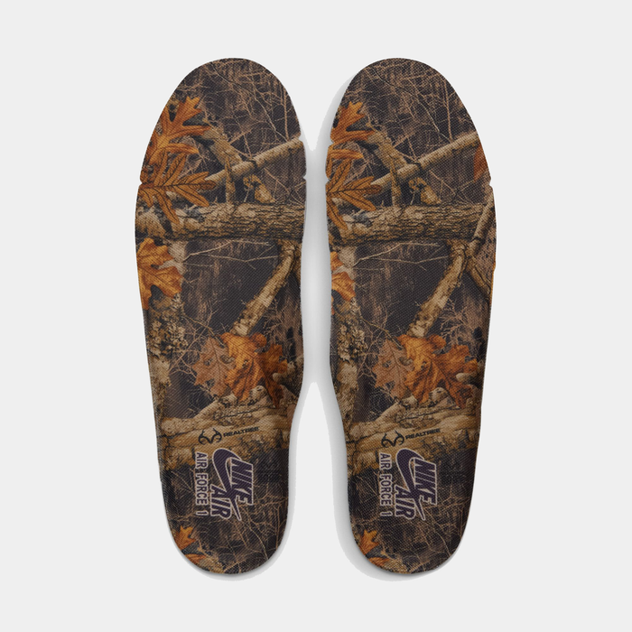 Nike Air Force 1 '07 RealTree insoles with camouflage print featuring branches and autumn leaves, top view.