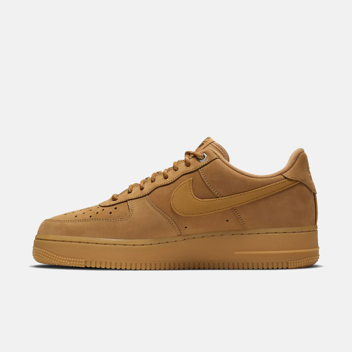 Tan sneaker with Nike logo on a white background