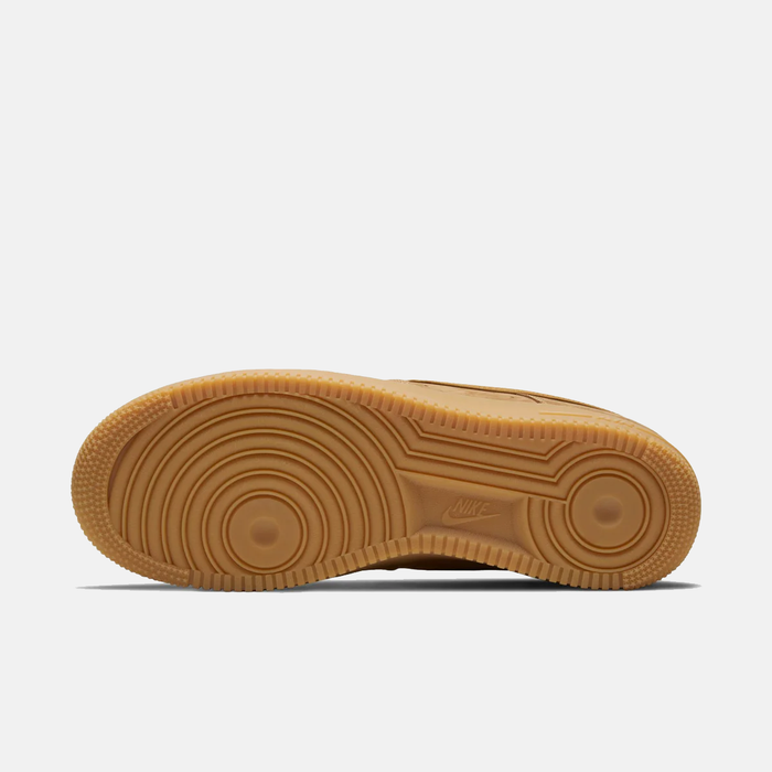 Brown sole of a sneaker on a white background