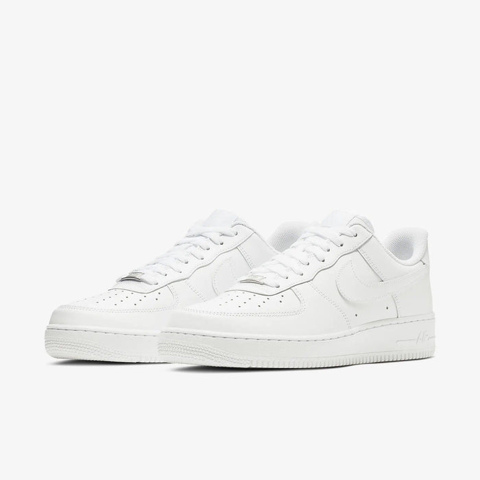 Nike Air Force 1 '07 sneakers in white leather with perforated toe box, signature Swoosh, and cushioned sole, angled front view.