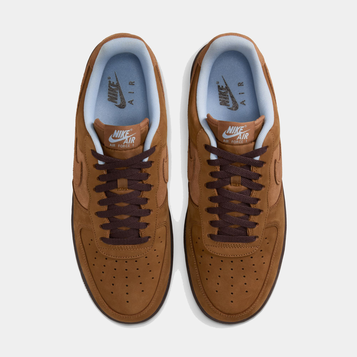 Nike Air Force 1 '07 sneakers, top view showing brown suede uppers, dark brown laces, perforated toe box, and light blue inner lining