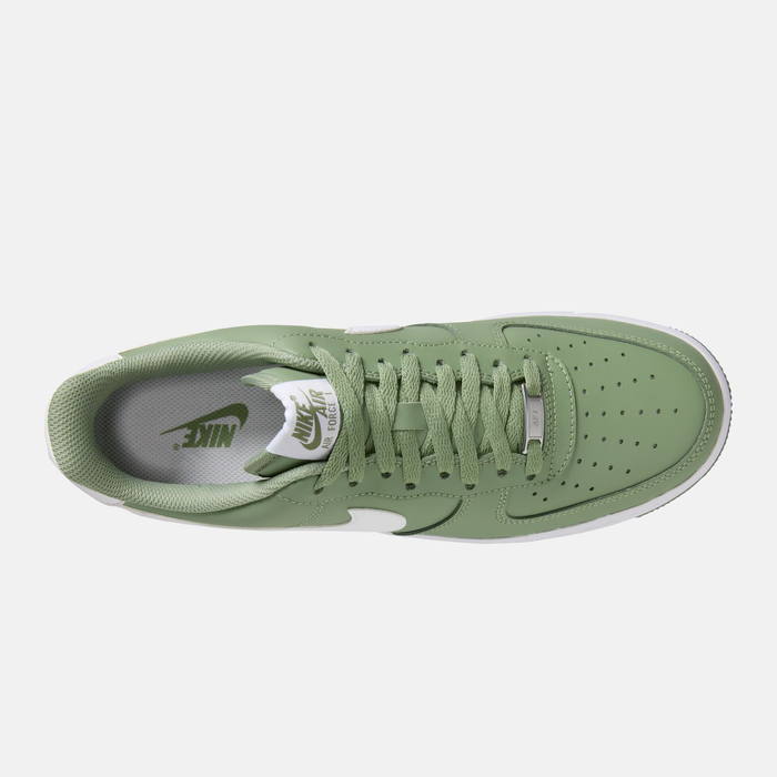 Nike Air Force 1 '07 sneakers in sage green leather with perforated toe box, white Nike branding, and sage green laces, top view.
