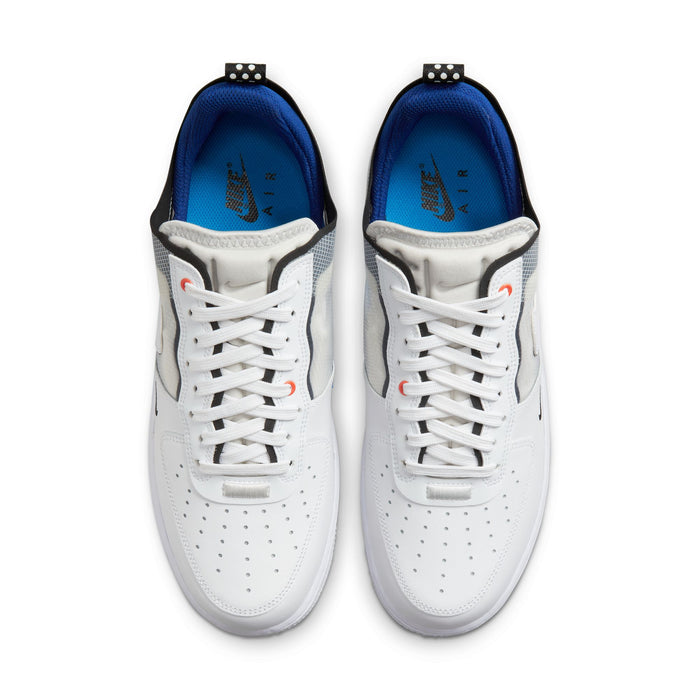 Nike Air Force 1 React sneakers in white with perforated toe box, black and gray accents, and blue insoles, top view.