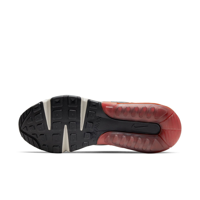 Nike Air Max 2090 shoes outsole in black and red rubber with textured grip and visible Air cushioning, sole/bottom view.