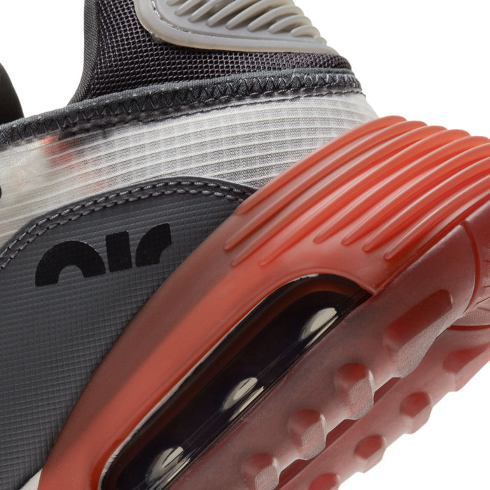 Nike Air Max 2090 running shoes back view showcasing red translucent outsole, textured heel panel, and gray mesh detailing.