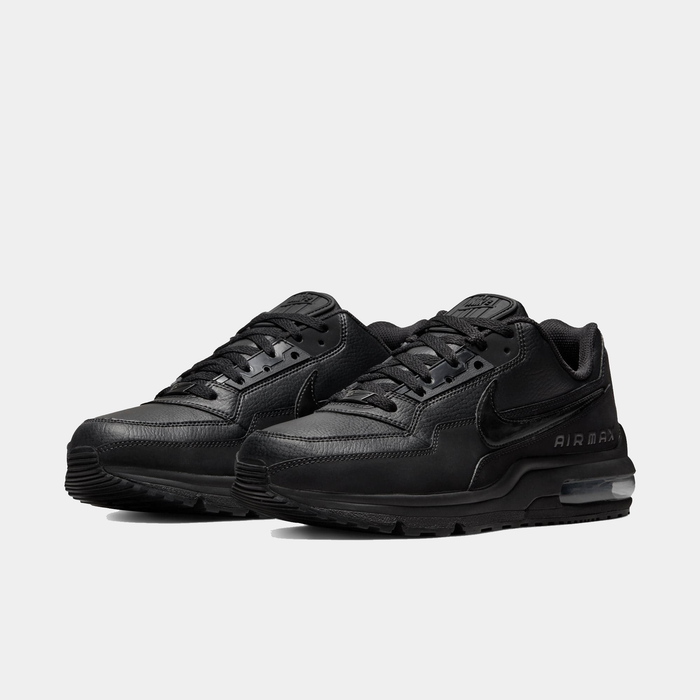 Black Nike Air Max sneakers on a light gray background