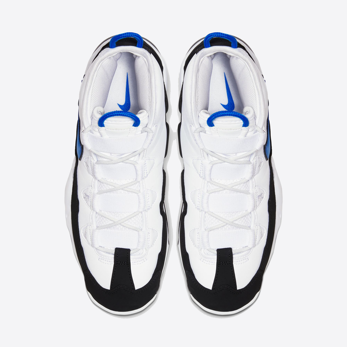 Nike Air Max Uptempo '95 basketball shoes in white with black overlays and royal blue accents, top view showing lace system and padded tongue.