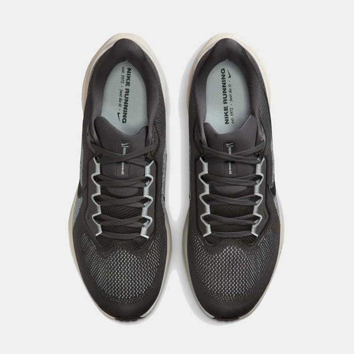 Pair of black Nike running shoes on a white background