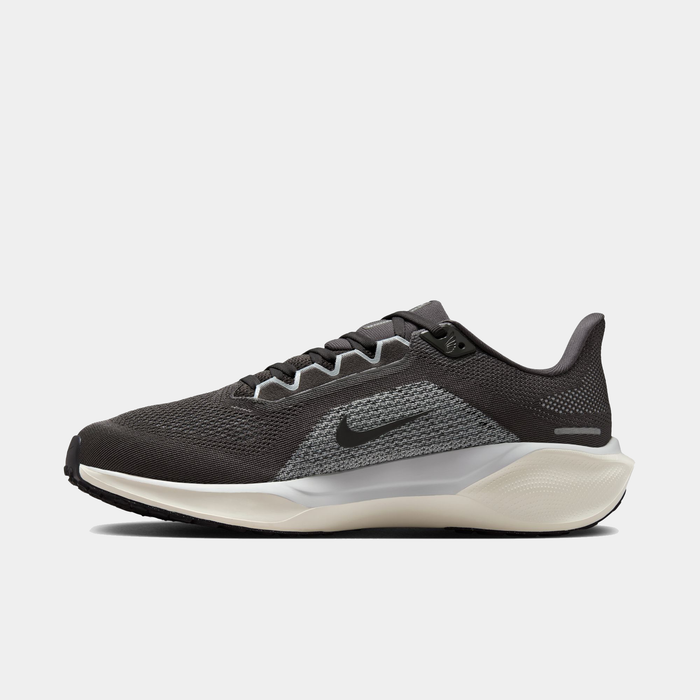 Black and gray running shoe with Nike logo on a white background