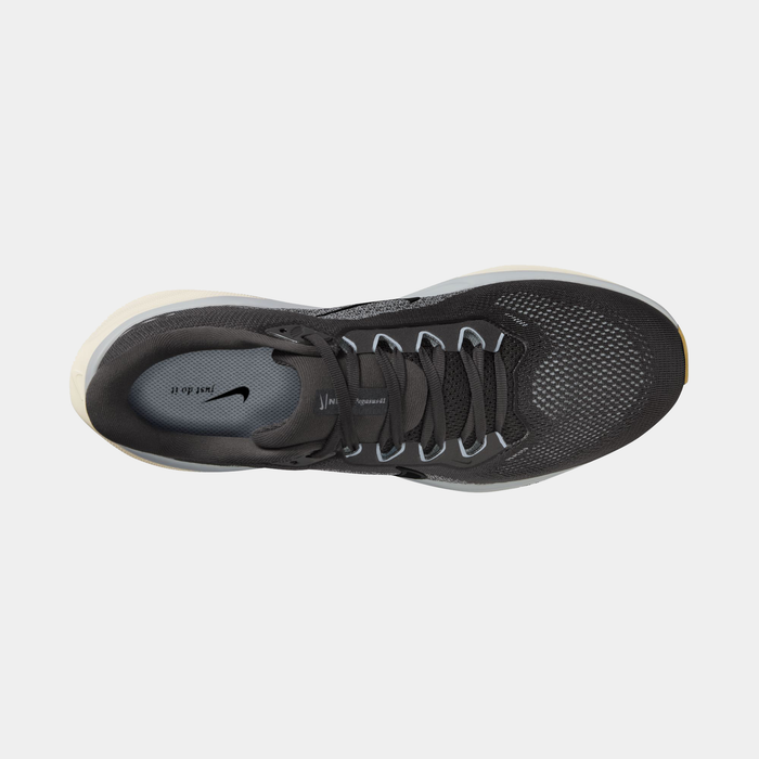 Black running shoe with Nike logo on a light gray background