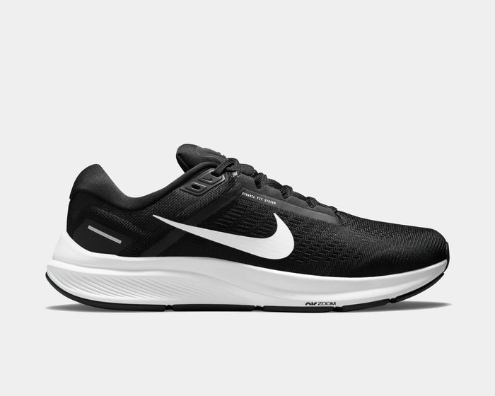 Nike Air Zoom Structure 24 running shoes in black with white sole and Swoosh logo, side view showing mesh upper and Dynamic Fit system.