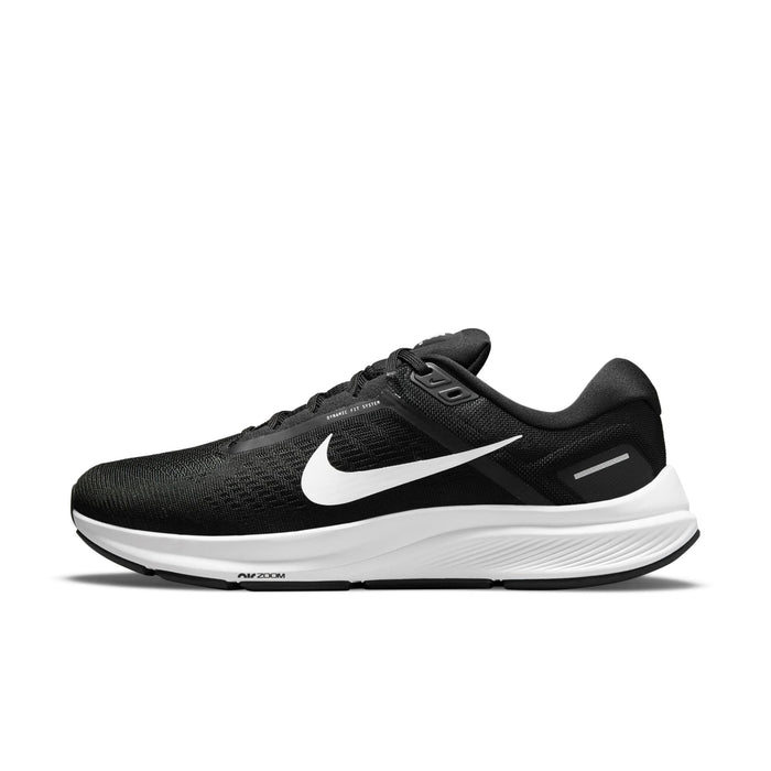 Nike Air Zoom Structure 24 running shoes in black with a breathable mesh upper, white midsole, and signature Swoosh logo, side view.