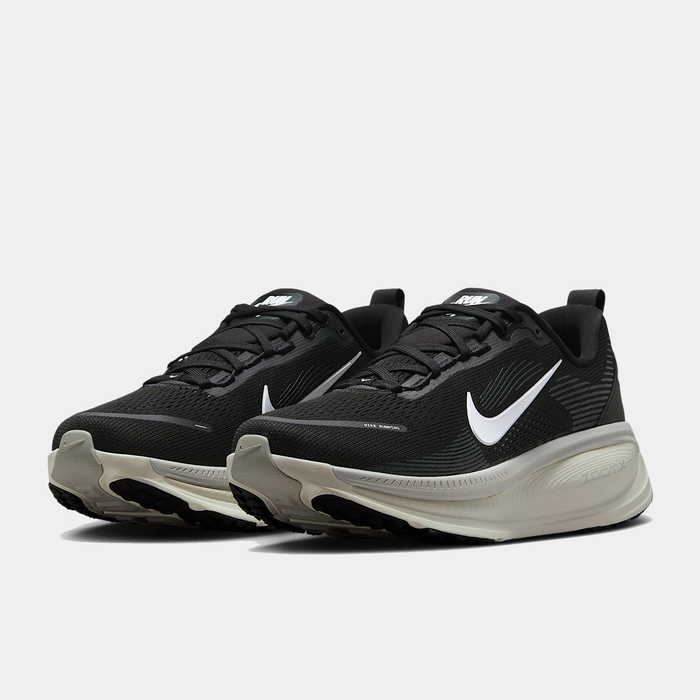 Nike Air Zoom Vomero 18 running shoes in black with white swoosh logo, breathable mesh upper, and cushioned midsole, front angle view.