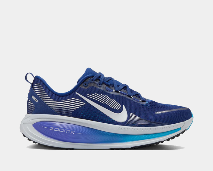 Nike Air Zoom Vomero 18 running shoes in royal blue with white detailing, cushioned ZoomX sole, and side view profile.