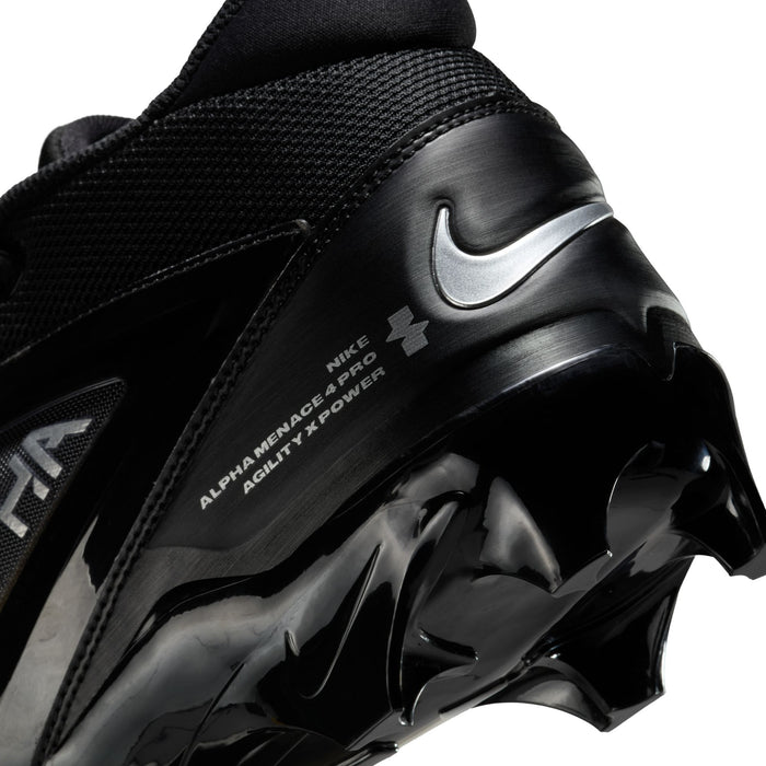 Nike Alpha Menace Elite 4 football cleats in black with textured upper, silver branding, and spiked outsole, side and heel close-up.