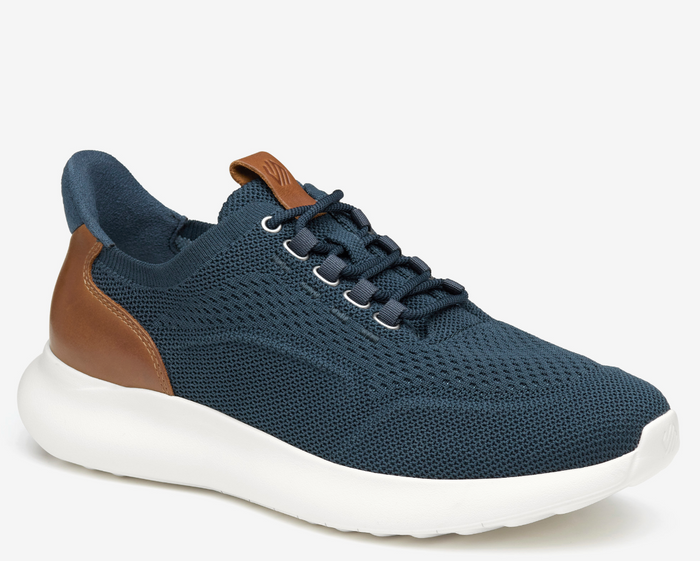 Johnston & Murphy Amherst 2.0 Knit Plain Toe shoes in navy blue with a breathable knit upper, tan leather heel accents, and white cushioned sole, side view.