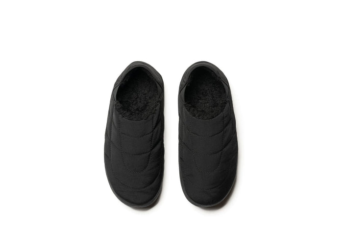 SeaVees Apres Puff Slip On shoes in solid black with quilted puff upper and fleece lining, top view.
