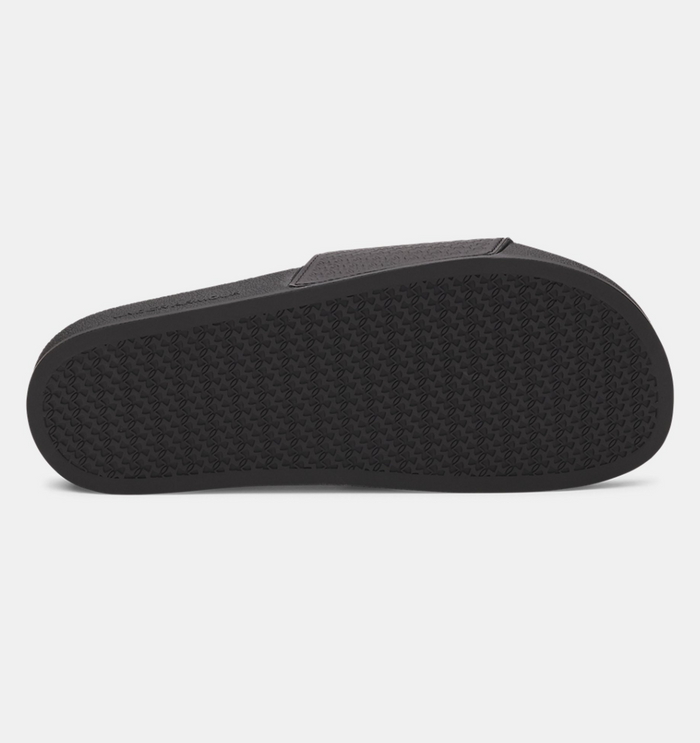Under Armour ARMR Slide sandals black with textured rubber outsole, bottom view.