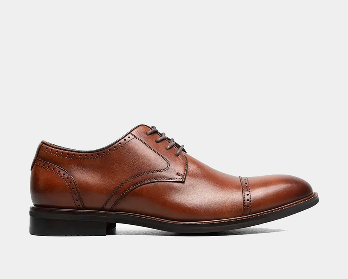 Stacy Adams Bailey Cap Toe dress shoe in rich brown leather with brogue detailing, side view showing sleek design and stacked heel.
