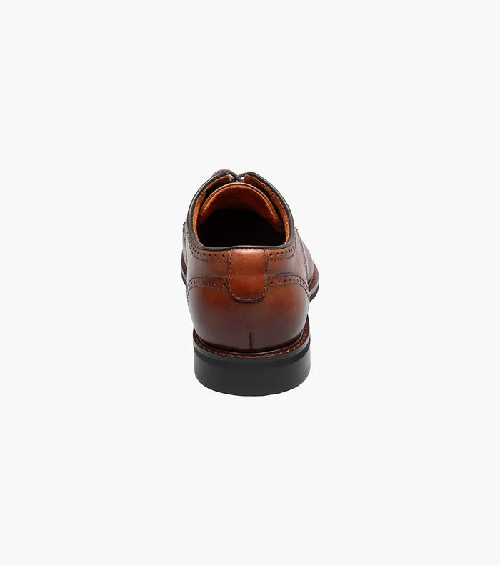 Stacy Adams Bailey Cap Toe dress shoes in cognac brown leather with brogue accents, back view showing heel and stitching details.