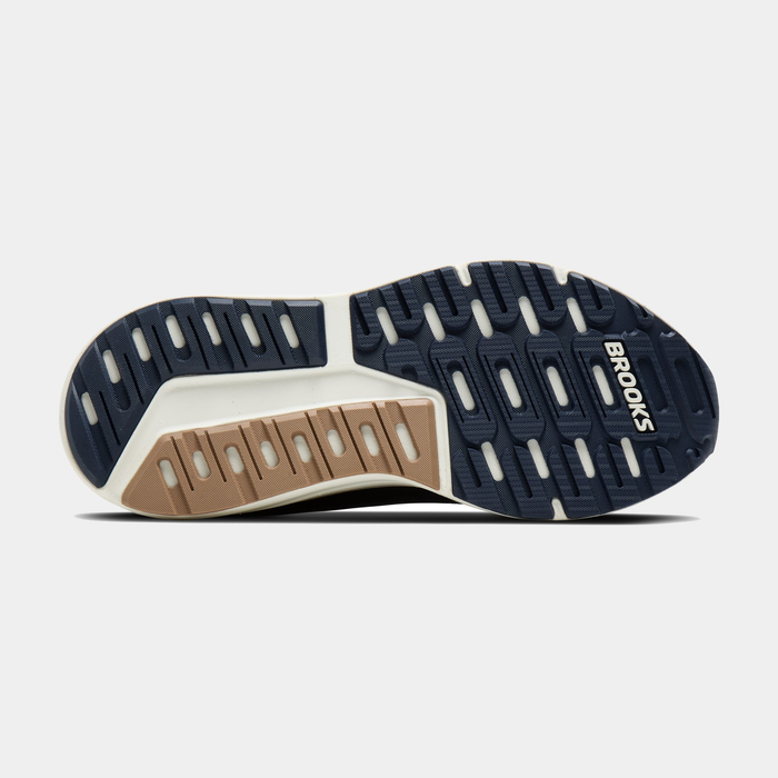 Brooks Beast GTS 26 running shoe outsole with durable tread pattern in navy blue, tan, and white rubber for traction and stability.