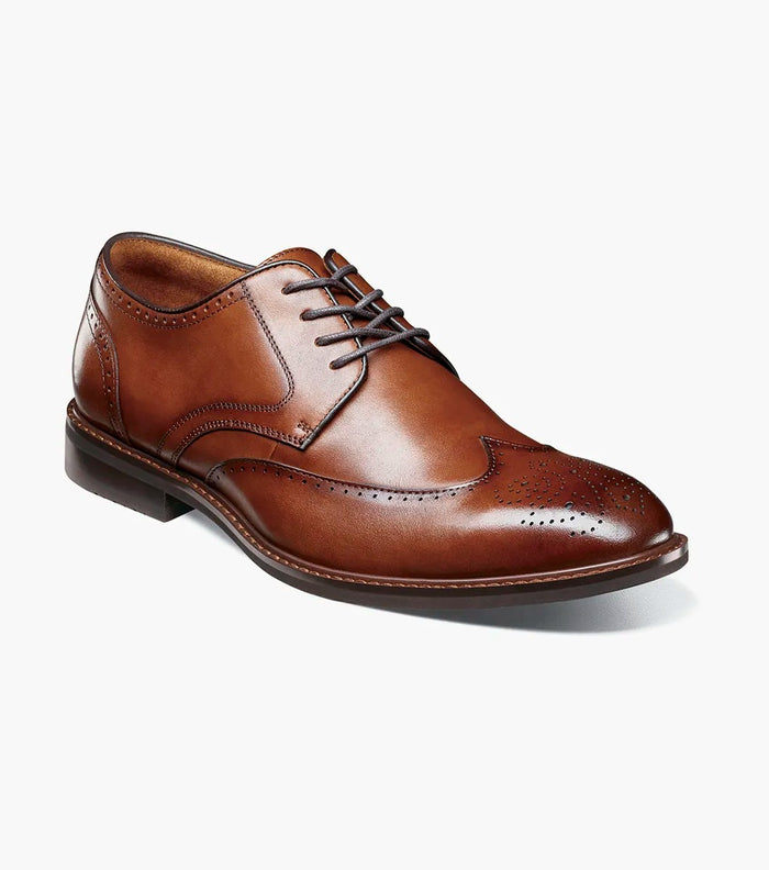 Stacy Adams Bennett Wingtip Oxford shoes in cognac leather with brogue detailing and closed lacing, angled front view.