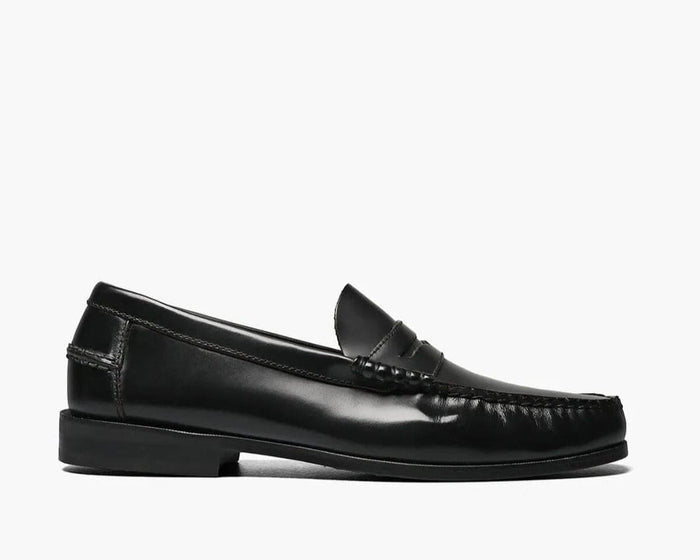 Florsheim Berkley Penny Loafer shoes in black leather with moc toe stitching and low stacked heel, side view.