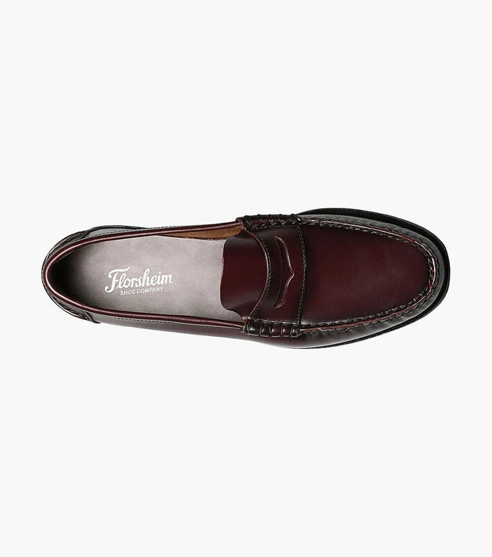 Florsheim Berkley Penny Loafer in burgundy leather with moc toe stitching, top view showing cushioned insole and slip-on design.