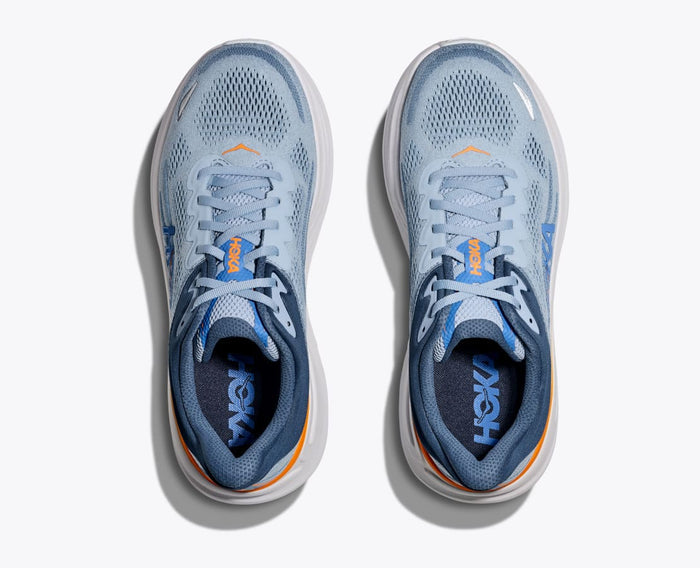 HOKA Bondi 9 running shoes in light blue with breathable mesh upper, orange accents, and cushioned collar, top view.