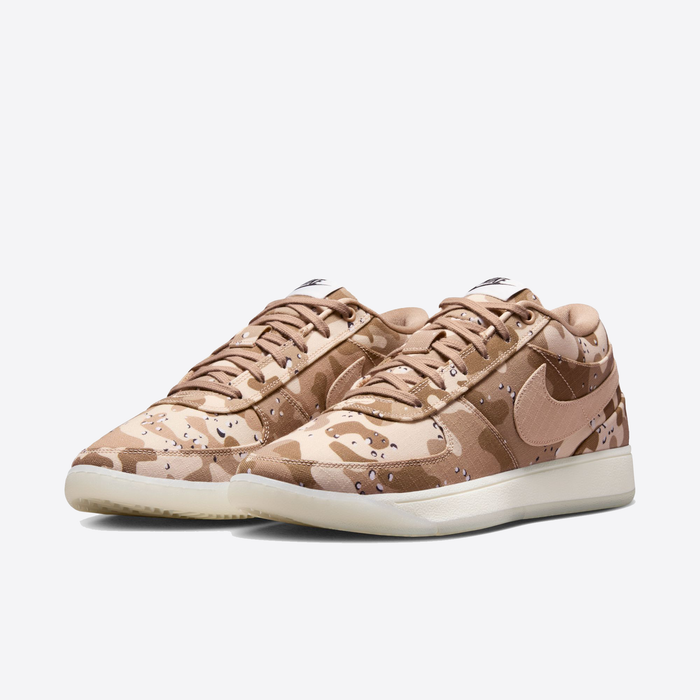 Nike Book 1 SE sneakers with desert camouflage pattern and beige Nike Swoosh, front side angle.