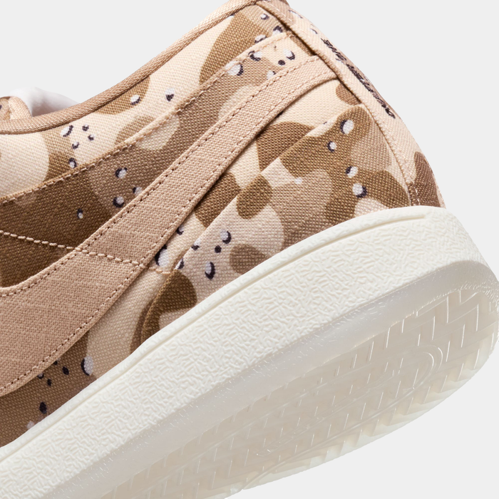Nike Book 1 SE sneakers with tan camouflage canvas upper and textured white outsole, close-up side heel view.