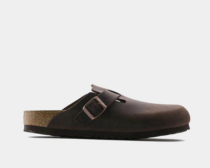 Birkenstock Boston Oiled Leather clogs in dark brown with adjustable buckle strap and cork footbed, side view.