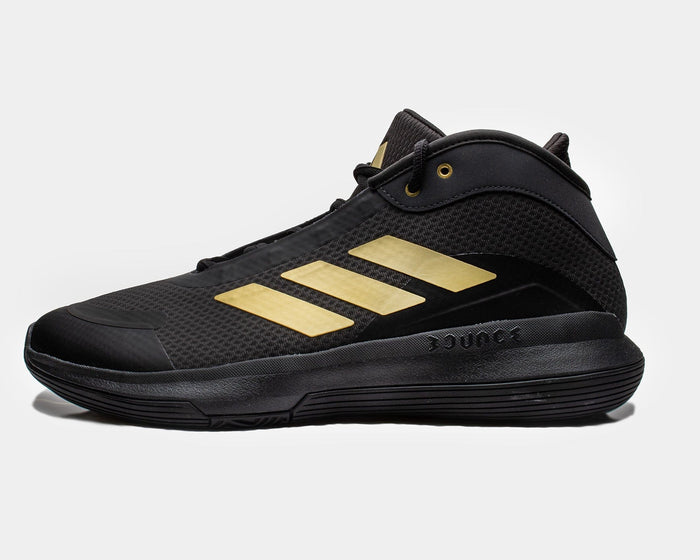 Adidas Bounce Legends basketball shoes in black with gold accents and mesh upper, side view showing Bounce midsole.