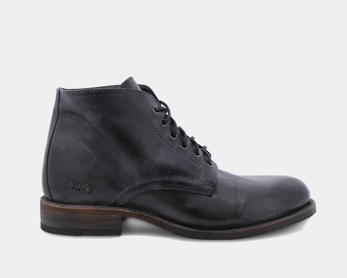 Bed Stu Bradley boots in distressed black leather with lace-up design and rustic wooden sole, side view.