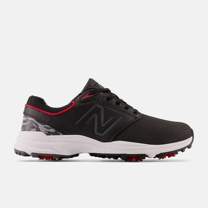 New Balance Golf Brighton Golf shoes in black with red accents, camouflage heel detail, and white outsole with red spikes, side view