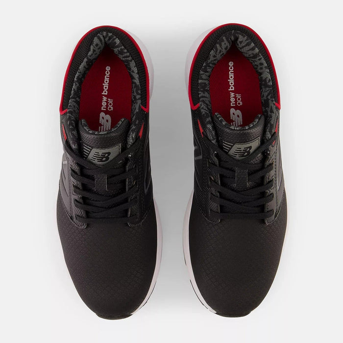 New Balance Golf Brighton Golf shoes in black with red interior accents, mesh upper, and white outsole, top view.