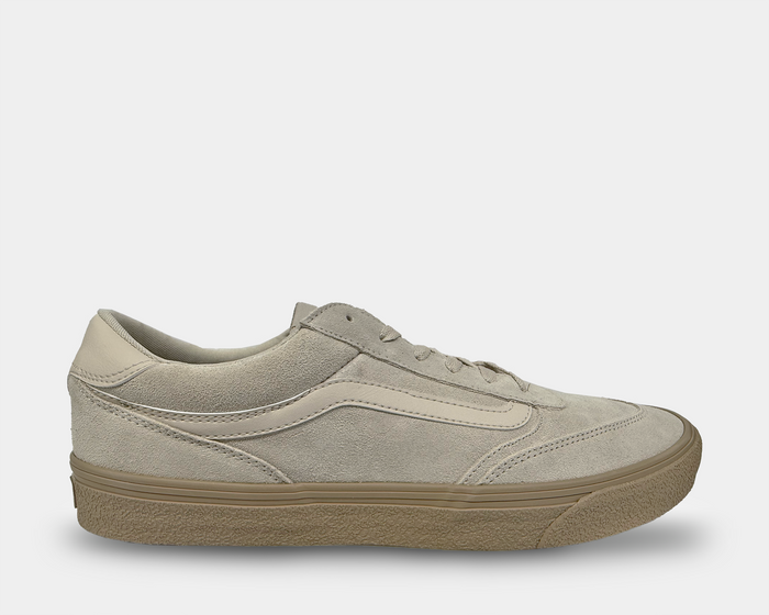 Vans Brooklyn sneakers in beige suede with leather accents, gum rubber sole, and lace-up closure, side view.
