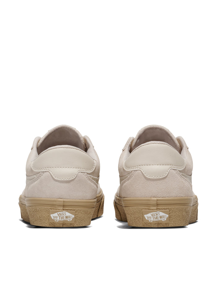 Vans Brooklyn shoes back view featuring beige suede upper, white leather heel accents, and textured gum outsole.