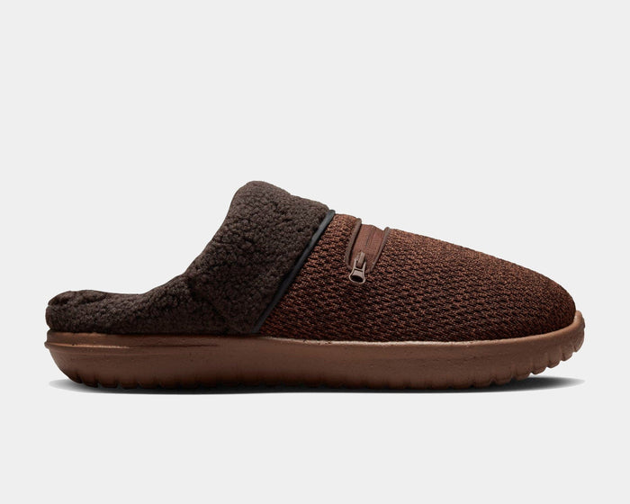 Nike Burrow SE slippers in dark brown with textured knit upper, fleece collar, zippered pocket, and rubber sole, side view.