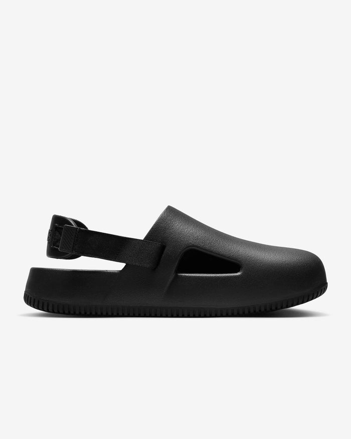 Nike Calm Mule shoes in black with textured foam material, adjustable heel strap, and ventilated cut-out detail, side view.