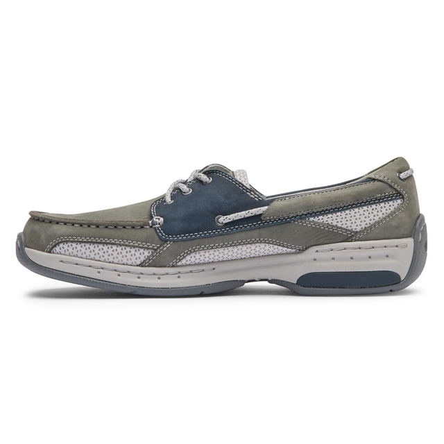 Dunham Captain boat shoes in gray and navy with perforated detailing, suede leather upper, and contrast stitching, side view.
