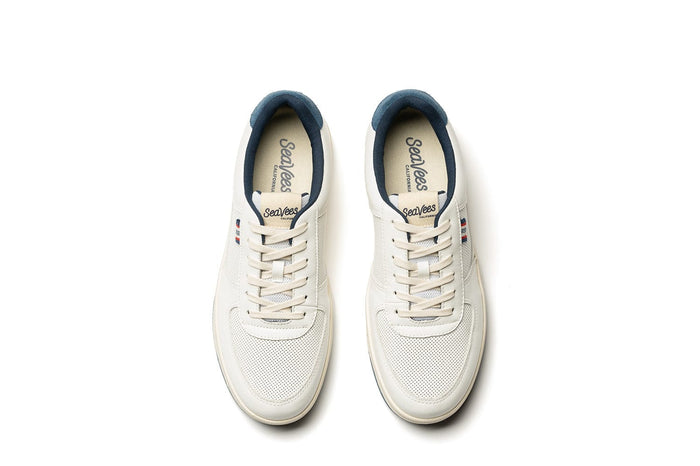 SeaVees Cardinal Sneaker top view with white leather upper, perforated toe box, navy blue collar lining, and lace-up closure.