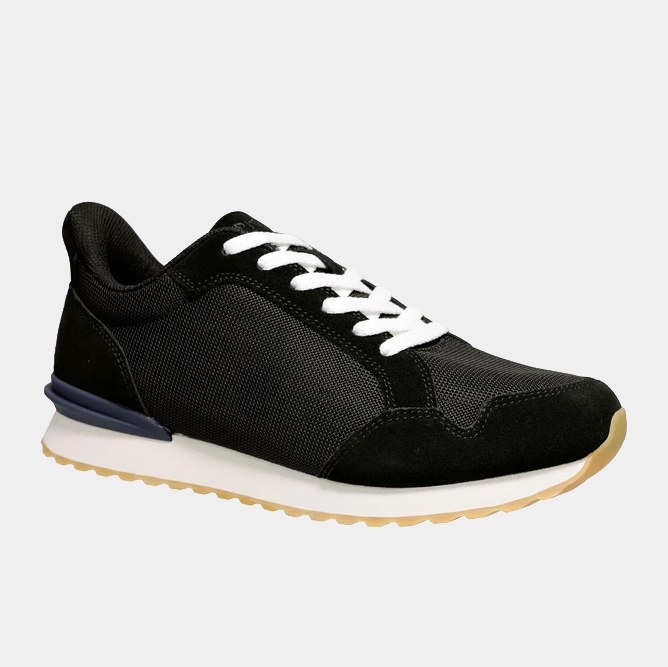 Propét Carmine Step In Sneakers in black with mesh and suede upper, white laces, and gum outsole, side view.