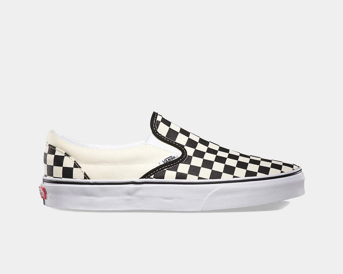 Vans Checkerboard Slip On shoes, black-and-white checkered canvas upper, white midsole, and red logo tab, side view.