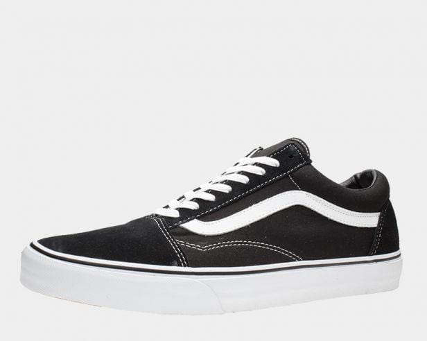 Vans Classic Old Skool sneakers, black canvas and suede upper with white leather side stripe and white rubber sole, side view.