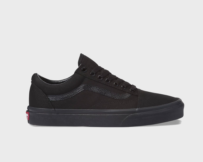 Vans Classic Old Skool sneakers in all-black suede and canvas with a signature side stripe and rubber waffle sole, side view.