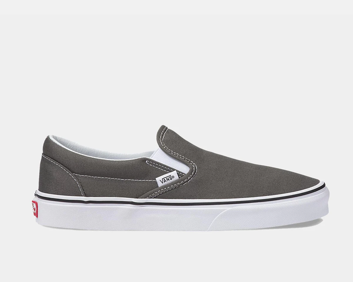 Vans Classic Slip On sneakers in gray canvas with white stitching, elastic side accents, and white rubber sole, side view.