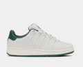 K-Swiss Classic VN sneakers in white leather with green accents and signature five-stripe design, side view.